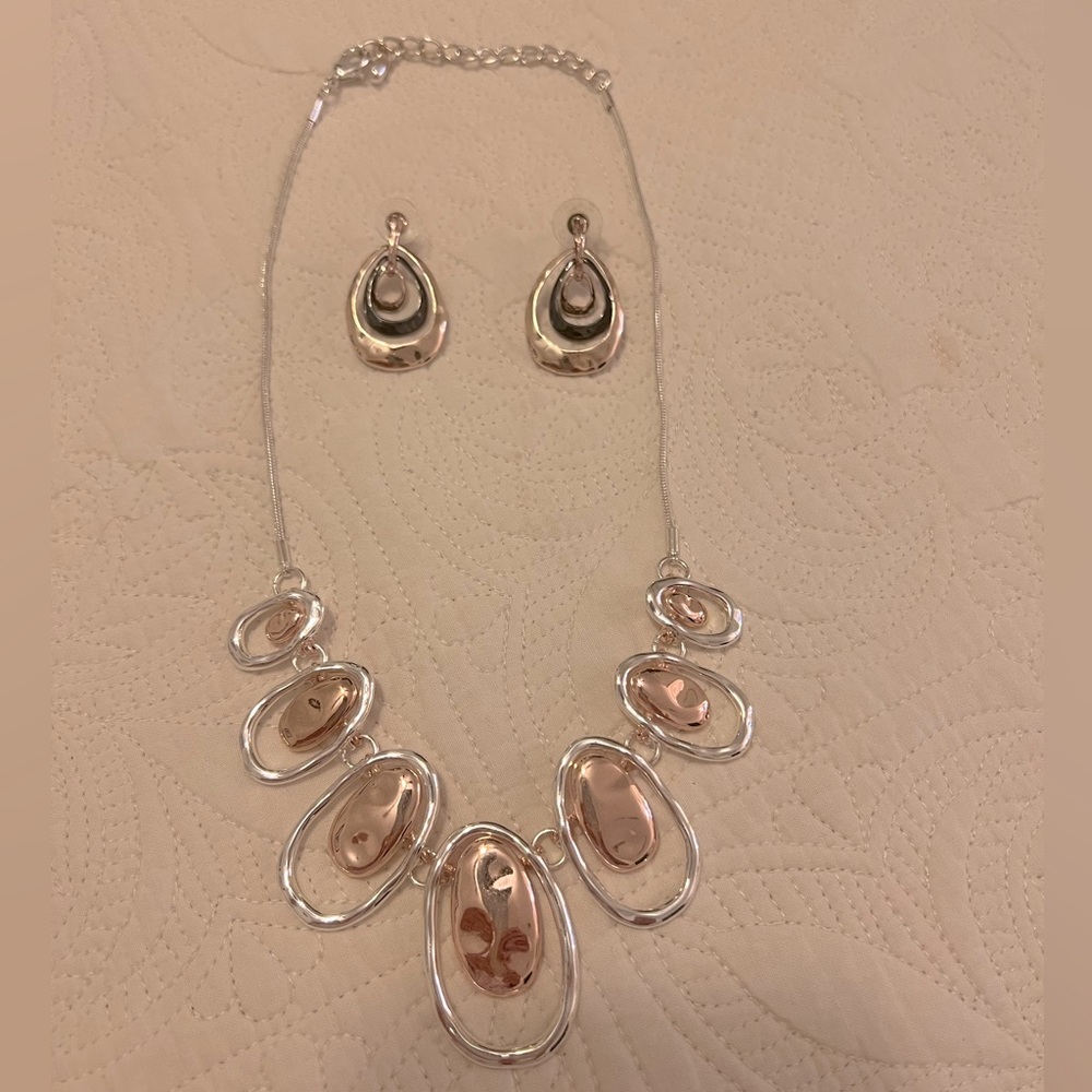 Necklace-silver overlay with copper accent.  Earrings-silver overlay and onyx.